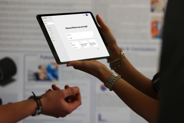 Person holding tablet wiht co-pilot on tablet. 