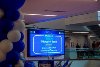 Large digital screen showing training options